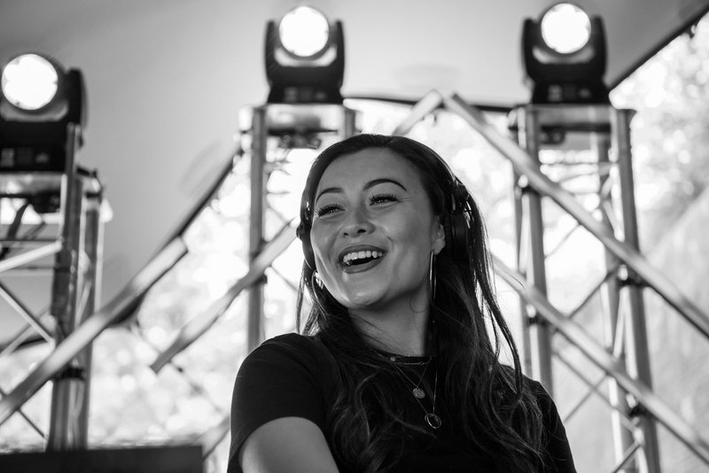 Demi laughing on the festival stage