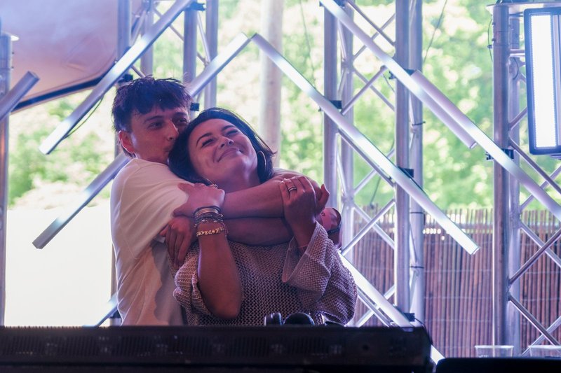 Demi and Robin sharing a moment on stage, festival setting